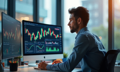 Analyste financier travaillant sur des graphiques colorés